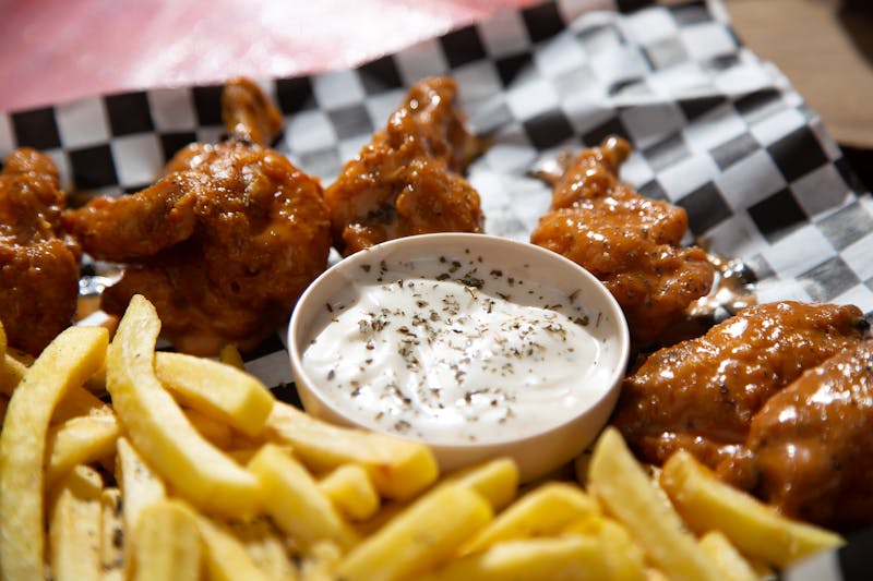 Wings appetizer with buffalo sauce and blue cheese dip
