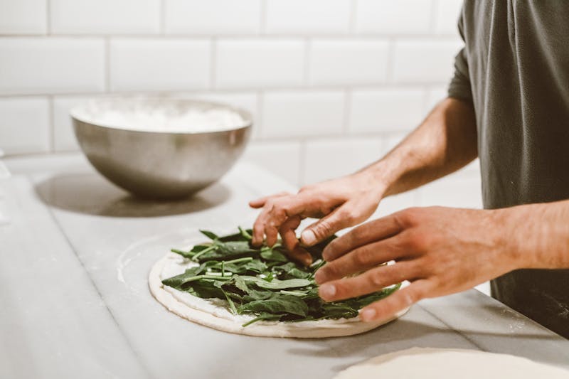 Mod Pizza restaurant kitchen with fresh pizza ingredients