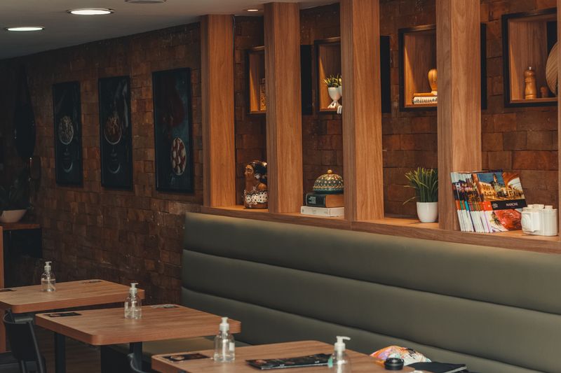 Modern seating area inside Mod Pizza restaurant